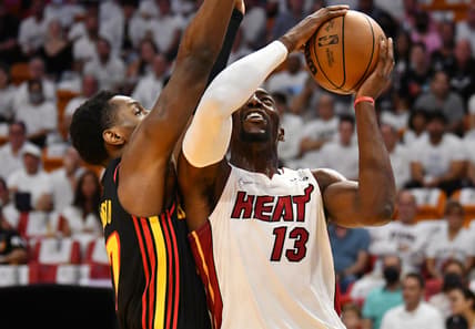 Apr 17, 2022; Miami, Florida, USA; Miami Heat center Bam Adebayo (13) goes up for a shot against Atlanta Hawks forward Onyeka Okongwu (17) during the first half of game one of the first round for the 2022 NBA playoffs at FTX Arena. Mandatory Credit: Jim Rassol-USA TODAY Sports