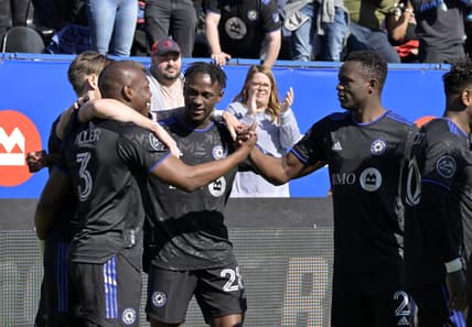 Apr 30, 2022; Montreal, Quebec, CAN; CF Montreal defender Kamal Miller (3) reacts with teammates including midfielder Romell Quioto (30) after scoring a goal against Atlanta United FC during the first half at Stade Saputo. Mandatory Credit: Eric Bolte-USA TODAY Sports