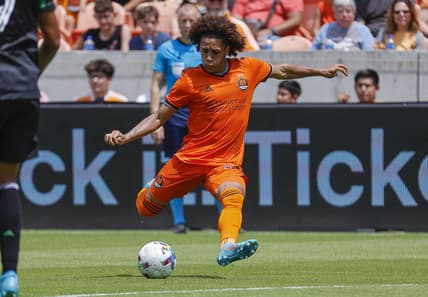 Apr 30, 2022; Houston, Texas, USA; Houston Dynamo FC midfielder Adalberto Carrasquilla (20) in action during the match against the Austin FC at PNC Stadium. Mandatory Credit: Troy Taormina-USA TODAY Sports