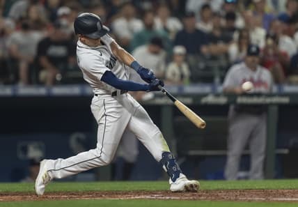 Sep 10, 2022; Seattle, Washington, USA; Seattle Mariners leftfielder Sam Haggerty (0) hits a solo home run off Atlanta Braves starting pitcher Max Fried (54) during the fifth inning at T-Mobile Park. Mandatory Credit: Stephen Brashear-USA TODAY Sports