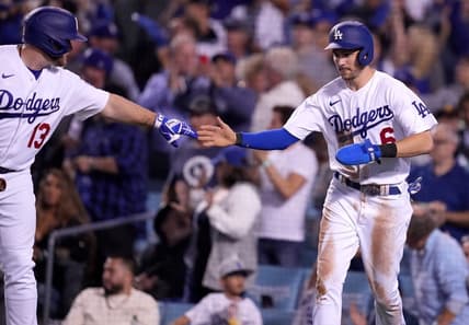 Oct 11, 2022; Los Angeles, California, USA; Los Angeles Dodgers shortstop Trea Turner (6) celebrates with third baseman Max Muncy (13) after scoring in the third inning of game one of the NLDS for the 2022 MLB Playoffs against the San Diego Padres at Dodger Stadium. Mandatory Credit: Kirby Lee-USA TODAY Sports