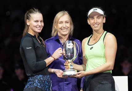 Nov 7, 2022; Forth Worth, TX, USA; Martina Navratilova, Elise Mertens (BEL) and Veronika Kudermetova pose with the trophy after winning the doubles final against Barbora Krejcikova (CZE) and Katerina Siniakova (CZE) on day eight of the WTA Finals at Dickies Arena.