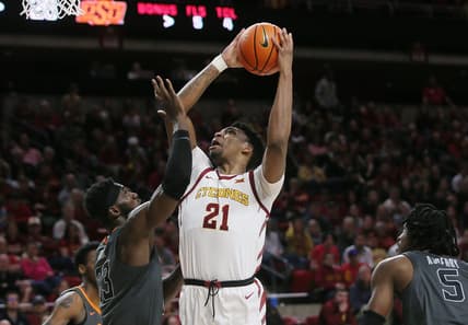 Iowa State University Cyclones center Osun Osunniyi (21) takes a shot over Oklahoma State Cowboys' forward Tyreek Smith (23) during the first half at Hilton Coliseum on Saturday, Feb. 11, 2023, in Ames, Iowa.

Oklahoma State And Iowa State Men S Basketball