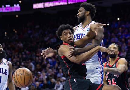 Dec 19, 2022; Philadelphia, Pennsylvania, USA; Toronto Raptors forward Thaddeus Young (21) looses control of the ball while driving against Philadelphia 76ers center Joel Embiid (21) during the second quarter at Wells Fargo Center. Mandatory Credit: Bill Streicher-USA TODAY Sports