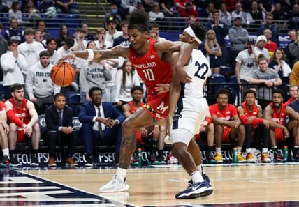 Mar 5, 2023; University Park, Pennsylvania, USA; Maryland Terrapins forward Julian Reese (10) tries to keep the ball in bounds as Penn State Nittany Lions guard Jalen Pickett (22) defends during the second half at Bryce Jordan Center. Mandatory Credit: Matthew OHaren-USA TODAY Sports