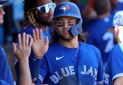 Mar 12, 2023; Clearwater, Florida, USA; Toronto Blue Jays shortstop Bo Bichette (11) scores a run against the Philadelphia Phillies during the fourth inning at BayCare Ballpark. Mandatory Credit: Kim Klement-USA TODAY Sports