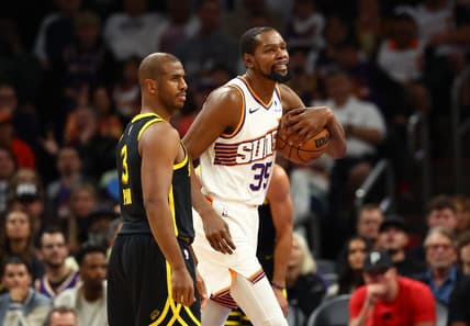 Nov 22, 2023; Phoenix, Arizona, USA; Phoenix Suns forward Kevin Durant (35) alongside Golden State Warriors guard Chris Paul (3) in the first half at Footprint Center. Mandatory Credit: Mark J. Rebilas-USA TODAY Sports