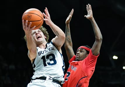 Dec 15, 2023; Indianapolis, Indiana, USA; Butler Bulldogs guard Finley Bizjack (13) goes to the basket against Saginaw Valley State Cardinals guard Curtis Jackson (2) during the first half at Hinkle Fieldhouse. Mandatory Credit: Robert Goddin-USA TODAY Sports