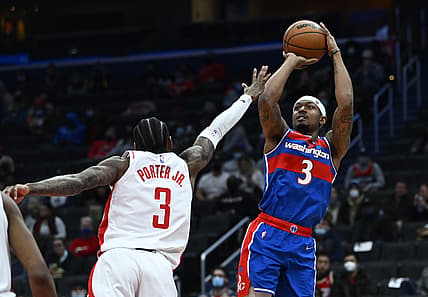 Jan 5, 2022; Washington, District of Columbia, USA; Washington Wizards guard Bradley Beal (3) shoots over Houston Rockets guard Kevin Porter Jr. (3) during the second half at Capital One Arena. Mandatory Credit: Brad Mills-USA TODAY Sports