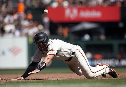 Sep 4, 2022; San Francisco, California, USA; San Francisco Giants catcher Austin Wynns tries to go from first to third on an RBI single by Bryce Johnson during the fourth inning against the Philadelphia Phillies at Oracle Park. Wynns was thrown out at third base on the play. Mandatory Credit: D. Ross Cameron-USA TODAY Sports