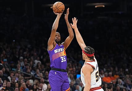 Mar 31, 2023; Phoenix, Arizona, USA; Phoenix Suns forward Kevin Durant (35) shoots over Denver Nuggets forward Aaron Gordon (50) during the first half at Footprint Center. Mandatory Credit: Joe Camporeale-USA TODAY Sports