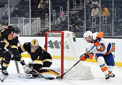 Apr 16, 2021; Boston, Massachusetts, USA; New York Islanders right wing Kyle Palmieri (21) tries to stuff the puck past Boston Bruins goaltender Jeremy Swayman (1) during the first period at TD Garden. Mandatory Credit: Bob DeChiara-USA TODAY Sports