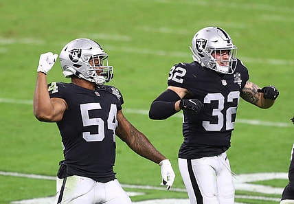 Dec 17, 2020; Paradise, Nevada, USA; Las Vegas Raiders linebacker Raekwon McMillan (54) celebrates a play with safety Dallin Leavitt (32) against the Los Angeles Chargers at Allegiant Stadium. Mandatory Credit: Mark J. Rebilas-USA TODAY Sports