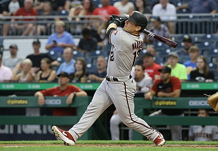 Aug 23, 2021; Pittsburgh, Pennsylvania, USA; Arizona Diamondbacks right fielder Daulton Varsho (12) hits a solo home run against the Pittsburgh Pirates during the second inning at PNC Park. Mandatory Credit: Charles LeClaire-USA TODAY Sports