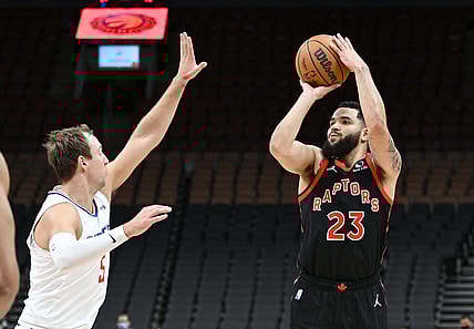 Dec 31, 2021; Toronto, Ontario, CAN; Toronto Raptors guard Fred VanVleet (23) shoots the ball against Los Angeles Clippers guard Luke Kennard (5) in the first half at Scotiabank Arena. Mandatory Credit: Dan Hamilton-USA TODAY Sports