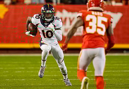 Dec 5, 2021; Kansas City, Missouri, USA; Denver Broncos wide receiver Jerry Jeudy (10) runs the ball as Kansas City Chiefs cornerback Charvarius Ward (35) defends during the second half at GEHA Field at Arrowhead Stadium. Mandatory Credit: Jay Biggerstaff-USA TODAY Sports