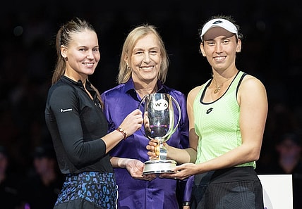 Nov 7, 2022; Forth Worth, TX, USA; Martina Navratilova, Elise Mertens (BEL) and Veronika Kudermetova pose with the trophy after winning the doubles final against Barbora Krejcikova (CZE) and Katerina Siniakova (CZE) on day eight of the WTA Finals at Dickies Arena.