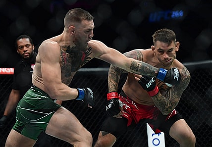 Jul 10, 2021; Las Vegas, Nevada, USA; Conor McGregor moves in for a hit against Dustin Poirier during UFC 264 at T-Mobile Arena. Mandatory Credit: Gary A. Vasquez-USA TODAY Sports