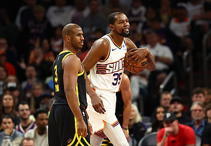 Nov 22, 2023; Phoenix, Arizona, USA; Phoenix Suns forward Kevin Durant (35) alongside Golden State Warriors guard Chris Paul (3) in the first half at Footprint Center. Mandatory Credit: Mark J. Rebilas-USA TODAY Sports