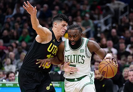 Jan 5, 2024; Boston, Massachusetts, USA; Boston Celtics guard Jaylen Brown (7) drives the ball against Utah Jazz forward Simone Fontecchio (16) in the second quarter at TD Garden. Mandatory Credit: David Butler II-USA TODAY Sports