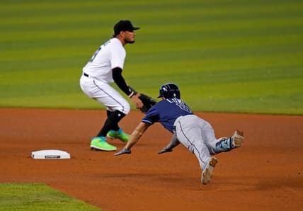 Apr 1, 2021; Miami, Florida, USA; Tampa Bay Rays second baseman Brandon Lowe (8) dives into second base for a double in the 4th inning against the Miami Marlins at loanDepot park. Mandatory Credit: Jasen Vinlove-USA TODAY Sports