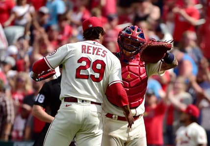 Jun 26, 2021; St. Louis, Missouri, USA;  St. Louis Cardinals catcher Yadier Molina (4) celebrates with relief pitcher Alex Reyes (29) after the Cardinals defeated the Pittsburgh Pirates at Busch Stadium. Mandatory Credit: Jeff Curry-USA TODAY Sports