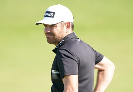 Jul 16, 2021; Sandwich, England, GB; Louis Oosthuizen  looks over his putt on the sixth green during the second  round of the Open Championship golf tournament. Mandatory Credit: Peter van den Berg-USA TODAY Sports