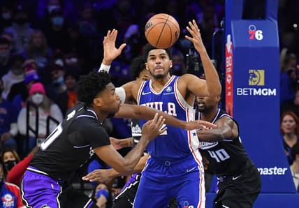 Jan 29, 2022; Philadelphia, Pennsylvania, USA; Philadelphia 76ers forward Tobias Harris (12) battles for the ball against Sacramento Kings center Damian Jones (30) and forward Harrison Barnes (40) during the second quarter at Wells Fargo Center. Mandatory Credit: Eric Hartline-USA TODAY Sports