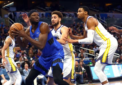 Mar 22, 2022; Orlando, Florida, USA; Orlando Magic center Mo Bamba (5) drives to the basket as Golden State Warriors guard Klay Thompson (11) defends during the second half at Amway Center. Mandatory Credit: Kim Klement-USA TODAY Sports