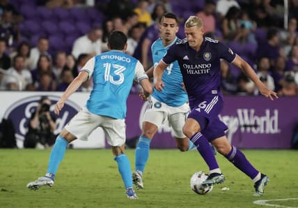 Apr 30, 2022; Orlando, Florida, USA; Orlando City defender Robin Jansson (6) controls the ball against Charlotte FC midfielder Brandt Bronico (13) during the second half at Exploria Stadium. Mandatory Credit: Kirby Lee-USA TODAY Sports