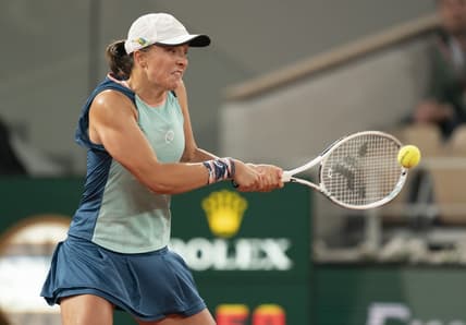 May 23, 2022; Paris, France; Iga Swiatek (POL) returns a shot during her match against Lesia Tsurenko (UKR) on day two of the French Open at Stade Roland-Garros.   Mandatory Credit: Susan Mullane-USA TODAY Sports