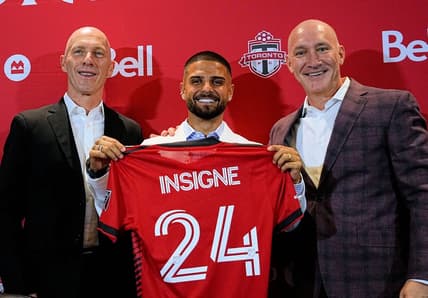 Jun 27, 2022; Toronto, Ontario, Canada; Toronto FC designated player Lorenzo Insigne (center) with president Bill Manning (right) and head coach Bob Bradley (left) at a press conference at BMO Field. Mandatory Credit: John E. Sokolowski-USA TODAY Sports