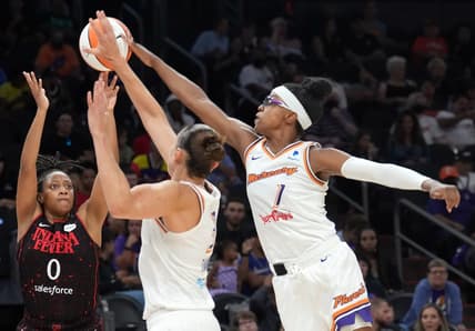 Jun 29, 2022; Phoenix, Arizona, USA; Phoenix Mercury guard Diamond DeShields (1) blocks a shot by Indiana Fever guard Kelsey Mitchell (0) during the second half at Footprint Center. Mandatory Credit: Joe Camporeale-USA TODAY Sports