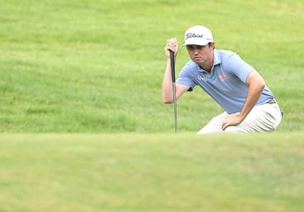 Jul 1, 2022; Silvis, Illinois, USA; J.T. Poston lines up a putt on the 1st hole during the second round of the John Deere Classic golf tournament. Mandatory Credit: Marc Lebryk-USA TODAY Sports