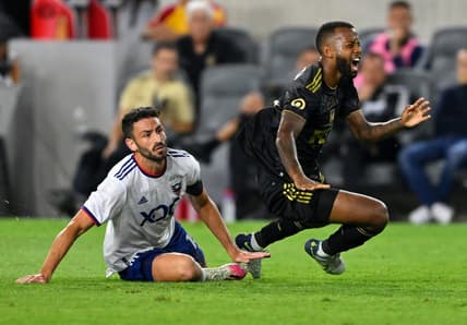 Aug 16, 2022; Los Angeles, California, USA; D.C. United defender Steve Birnbaum (15) is shown a red card for a second caution by referee Ramy Touchan (not pictured) at after a foul on LAFC midfielder Kellyn Acosta (23) in the second half of the game at Banc of California Stadium. Mandatory Credit: Jayne Kamin-Oncea-USA TODAY Sports