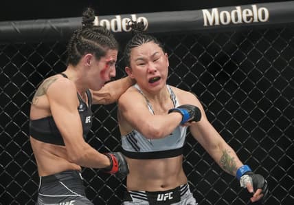 Mar 5, 2022; Las Vegas, Nevada, UNITED STATES; Marina Rodriguez (red gloves) fights Yan Xiaonan (blue gloves) during UFC 272 at T-Mobile Arena. Mandatory Credit: Stephen R. Sylvanie-USA TODAY Sports