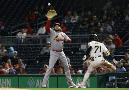Oct 4, 2022; Pittsburgh, Pennsylvania, USA;  Pittsburgh Pirates center fielder Ji Hwan Bae (71) beats the throw to St. Louis Cardinals first baseman Alec Burleson (41) for an RBI single during the third inning at PNC Park. Mandatory Credit: Charles LeClaire-USA TODAY Sports