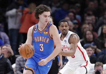 Dec 31, 2022; Oklahoma City, Oklahoma, USA; Oklahoma City Thunder guard Josh Giddey (3) controls the ball against Philadelphia 76ers guard De'Anthony Melton (8) during the first quarter at Paycom Center. Mandatory Credit: Alonzo Adams-USA TODAY Sports