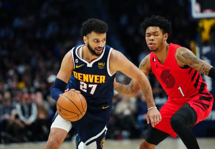 Jan 17, 2023; Denver, Colorado, USA; Denver Nuggets guard Jamal Murray (27) dribbles past Portland Trail Blazers guard Anfernee Simons (1) in the first quarter at Ball Arena. Mandatory Credit: Ron Chenoy-USA TODAY Sports