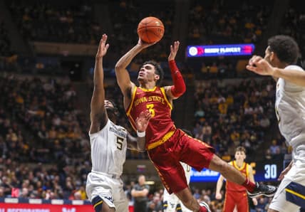 Feb 8, 2023; Morgantown, West Virginia, USA; Iowa State Cyclones guard Tamin Lipsey (3) shoots in the lane against West Virginia Mountaineers guard Joe Toussaint (5) during the first half at WVU Coliseum. Mandatory Credit: Ben Queen-USA TODAY Sports