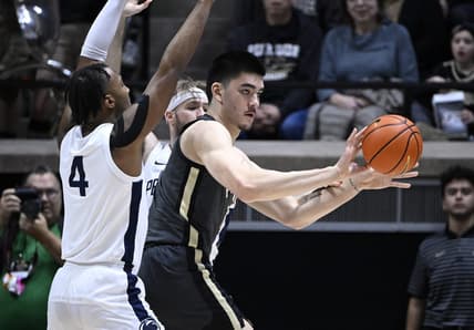 Feb 1, 2023; West Lafayette, Indiana, USA;  Purdue Boilermakers center Zach Edey (15) passes the ball away from Penn State Nittany Lions forward Caleb Dorsey (4) and forward Michael Henn (24) during the first half at Mackey Arena. Mandatory Credit: Marc Lebryk-USA TODAY Sports