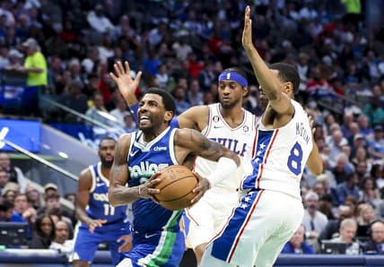 Mar 2, 2023; Dallas, Texas, USA;  Dallas Mavericks guard Kyrie Irving (2) drives to the basket past Philadelphia 76ers guard De'Anthony Melton (8) during the second quarter at American Airlines Center. Mandatory Credit: Kevin Jairaj-USA TODAY Sports