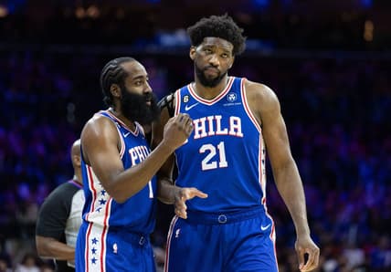 Feb 1, 2023; Philadelphia, Pennsylvania, USA; Philadelphia 76ers guard James Harden (1) and center Joel Embiid (21) talks during a break in the fourth quarter against the Orlando Magic at Wells Fargo Center. Mandatory Credit: Bill Streicher-USA TODAY Sports