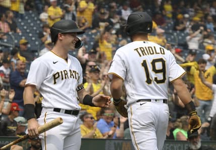 Jun 29, 2023; Pittsburgh, Pennsylvania, USA; Pittsburgh Pirates right fielder Henry Davis (left) congratulates third baseman Jared Triolo (19) after Triolo scored a run on a San Diego Padres error during the seventh inning at PNC Park. Pittsburgh won 5-4. Mandatory Credit: Charles LeClaire-USA TODAY Sports