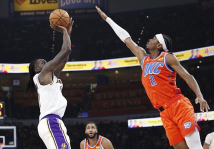 Dec 23, 2023; Oklahoma City, Oklahoma, USA; Los Angeles Lakers forward Taurean Prince (12) shoots as Oklahoma City Thunder guard Shai Gilgeous-Alexander (2) defends during the second quarter at Paycom Center. Mandatory Credit: Alonzo Adams-USA TODAY Sports