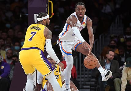 Nov 4, 2021; Los Angeles, California, USA; Los Angeles Lakers forward Carmelo Anthony (7) guards Oklahoma City Thunder guard Shai Gilgeous-Alexander (2) in the second half at Staples Center. Mandatory Credit: Jayne Kamin-Oncea-USA TODAY Sports