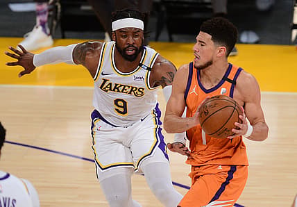 May 30, 2021; Los Angeles, California, USA; Phoenix Suns guard Devin Booker (1) moves to the basket against Los Angeles Lakers guard Wesley Matthews (9) during the first half in game four of the first round of the 2021 NBA Playoffs. at Staples Center. Mandatory Credit: Gary A. Vasquez-USA TODAY Sports