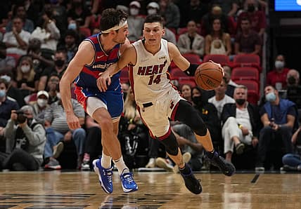 Dec 28, 2021; Miami, Florida, USA; Washington Wizards forward Corey Kispert (24) fouls Miami Heat guard Tyler Herro (14) during the second half at FTX Arena. Mandatory Credit: Jasen Vinlove-USA TODAY Sports