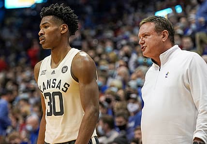 Feb 14, 2022; Lawrence, Kansas, USA; Kansas Jayhawks head coach Bill Self talks with guard Ochai Agbaji (30) against the Oklahoma State Cowboys during the game at Allen Fieldhouse. Mandatory Credit: Denny Medley-USA TODAY Sports