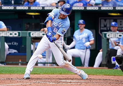 Jul 24, 2022; Kansas City, Missouri, USA; Kansas City Royals second baseman Nicky Lopez (8) hits a single against the Tampa Bay Rays in the seventh inning at Kauffman Stadium. Mandatory Credit: Denny Medley-USA TODAY Sports